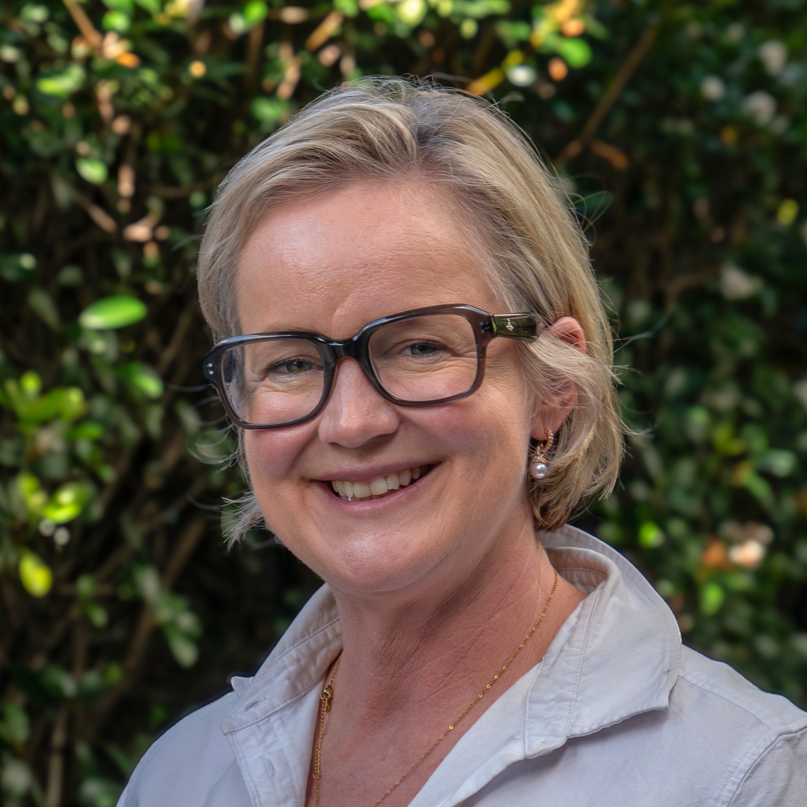 Jac smiling with glasses on